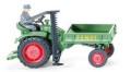 Fendt tractor with driver and mower mechanism